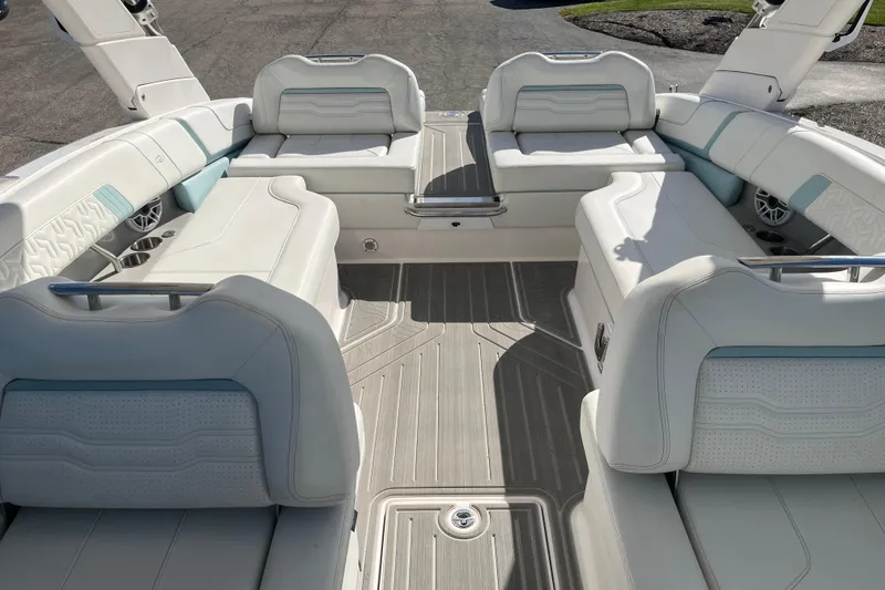 Slide: The Image of 2024 Regal LS9 Surf boat interior with luxurious white seating and modern design. - 14