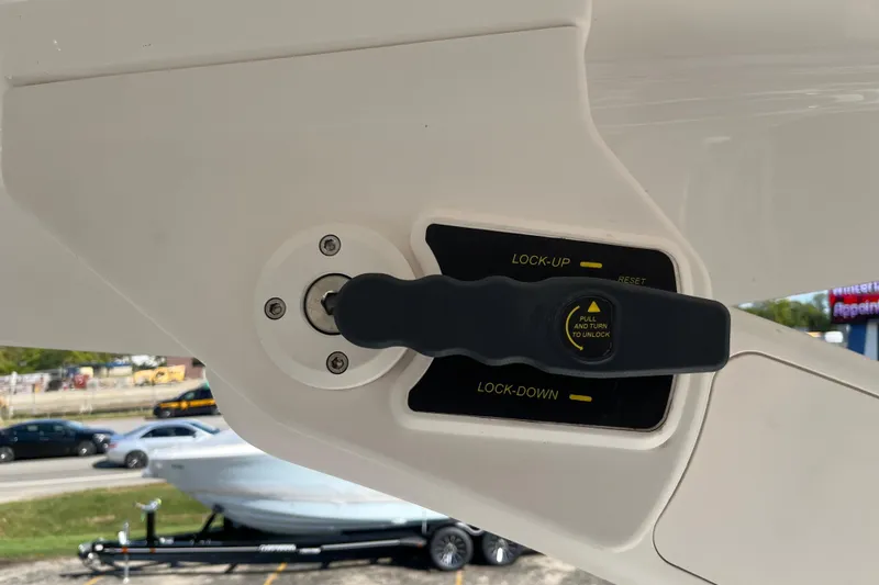 Slide: The Image of 2024 Regal LS9 Surf boat control lever with lock-up and lock-down settings. - 19