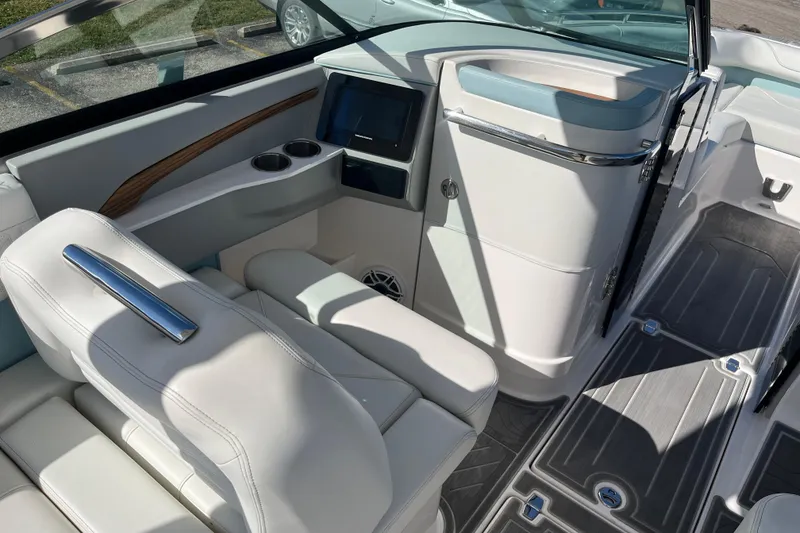 Slide: The Image of 2024 Regal LS9 Surf boat interior with luxurious seating and modern dashboard design. - 20