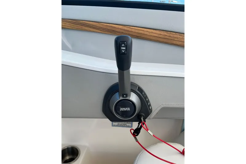 Slide: The Image of Throttle control of 2024 Regal LS9 Surf boat with Volvo Penta branding. - 28