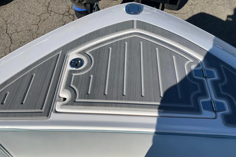 Slide: The Image of 2024 Regal LS9 Surf boat deck with textured gray surface and sleek design. - 3