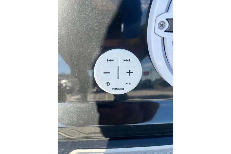 Slide: The Image of Control panel on 2024 Regal LS9 Surf boat, featuring Fusion audio controls. - 30