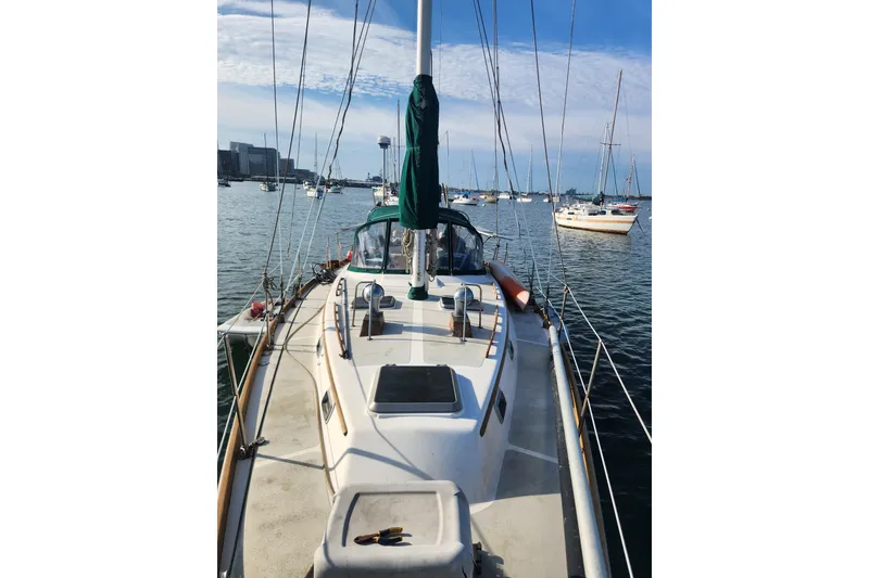 Slide: The Image of 1981 Guflstar Center Cockpit sailboat on calm water, surrounded by other boats. - 11