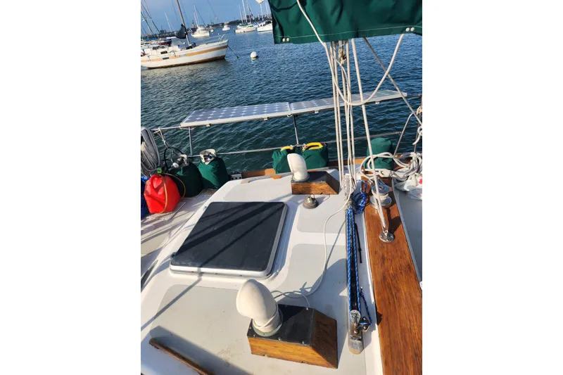 Slide: The Image of 1981 Guflstar Center Cockpit sailboat deck with solar panel and nautical equipment. - 18