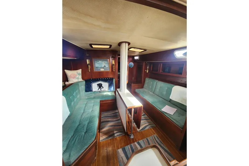 Slide: The Image of Interior of 1981 Guflstar Center Cockpit with teal seating and wooden accents. - 29