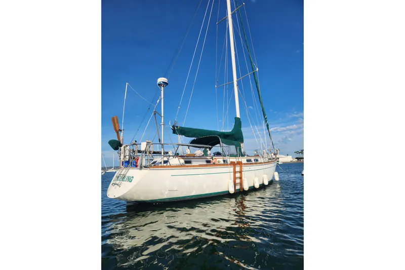 Slide: The Image of 1981 Guflstar Center Cockpit sailboat on calm water under clear blue sky. - 3