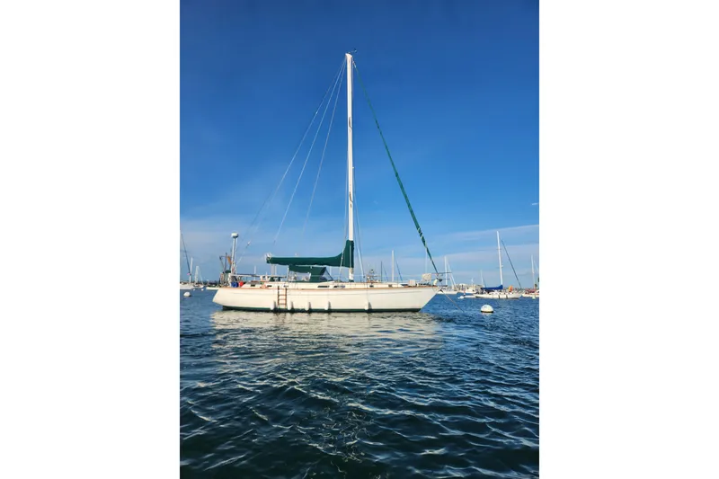 Slide: The Image of 1981 Guflstar Center Cockpit sailboat on calm water under clear blue sky. - 4