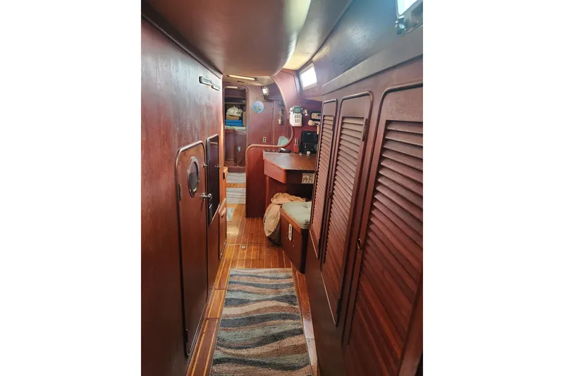 Slide: The Image of Interior of 1981 Guflstar Center Cockpit sailboat with wooden finishes and cozy design. - 41
