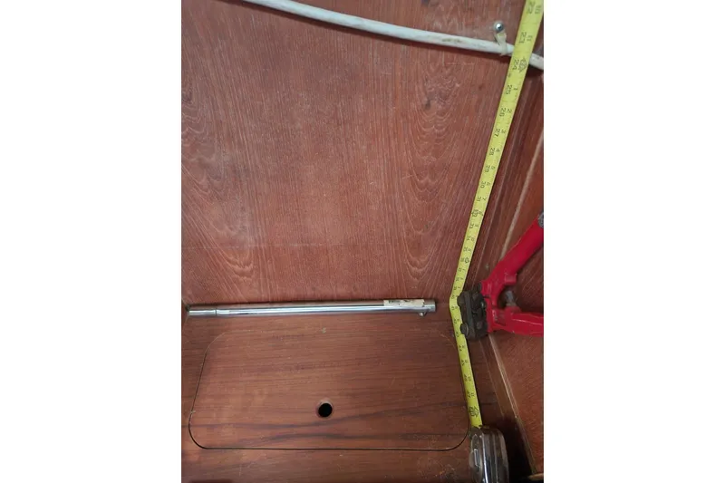 Slide: The Image of Interior of 1981 Guflstar Center Cockpit with measuring tape and tools. - 43