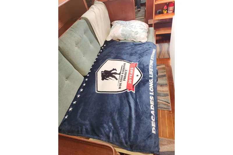 Slide: The Image of Cozy interior of 1981 Guflstar Center Cockpit with Wounded Warrior Project blanket. - 58