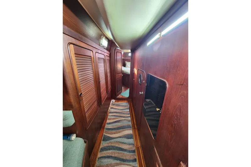 Slide: The Image of Interior of 1981 Guflstar Center Cockpit with wooden paneling and striped carpet. - 62