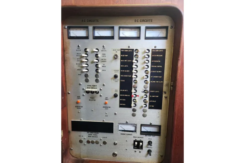 Slide: The Image of Electrical control panel on a 1981 Guflstar Center Cockpit boat, featuring AC and DC circuits. - 75