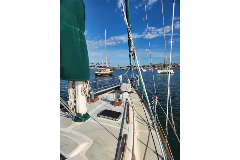 Slide: The Image of 1981 Guflstar Center Cockpit sailboat on calm water under a clear blue sky. - 8