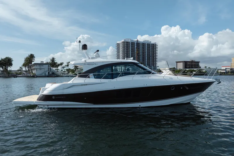 The Image of 2016 Cruisers Cantius yacht on water with cityscape background. - 0