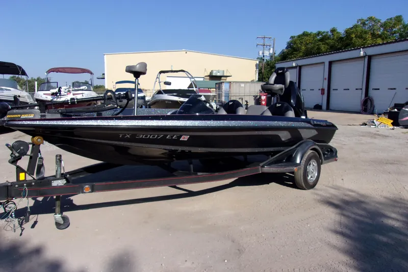 The Image of 2009 Ranger 188 VX boat on trailer in outdoor storage area. - 1