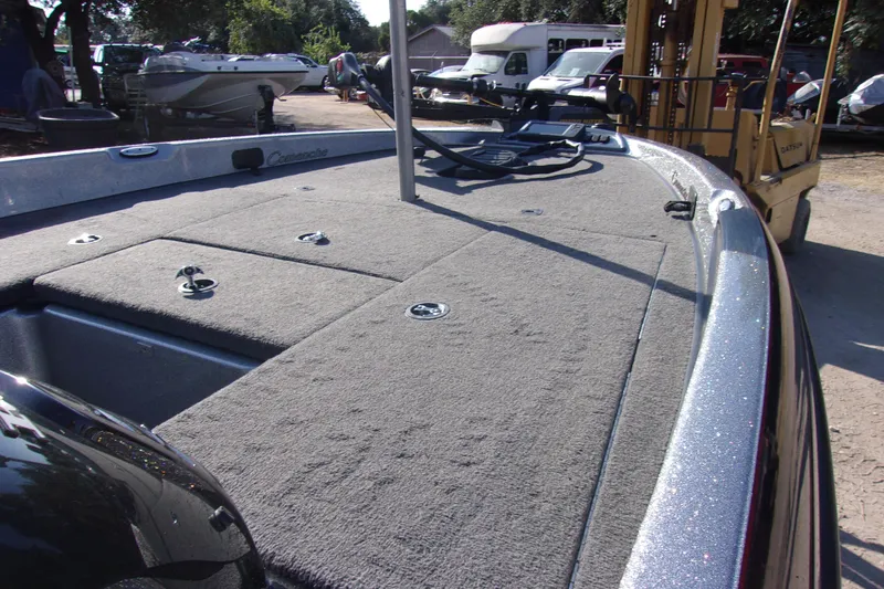 Slide: The Image of 2009 Ranger 188 VX boat deck with carpeted surface and storage compartments. - 9
