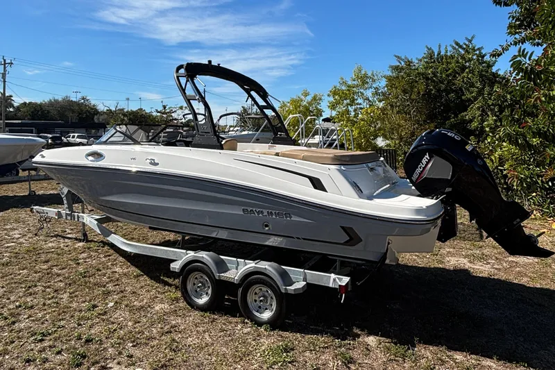 Slide: The Image of 2026 Bayliner VR6 Bowrider OB interior with open storage compartment, showcasing sleek design. - 14