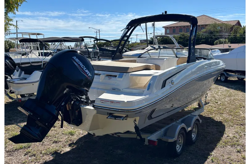 Slide: The Image of 2026 Bayliner VR6 Bowrider OB interior with tan seating and sleek design. - 15