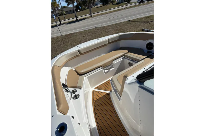 Slide: The Image of 2026 Bayliner VR6 Bowrider OB with spacious seating and sleek design under a blue sky. - 19