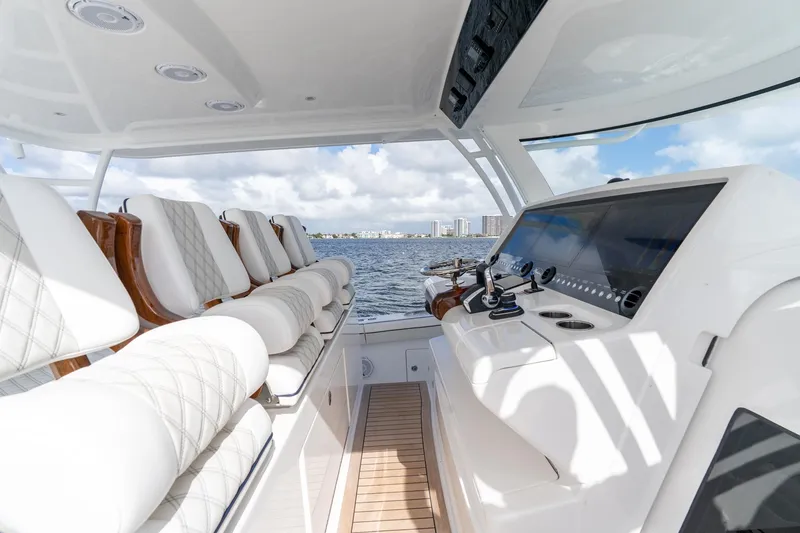 Slide: The Image of Interior view of 2025 Valhalla Boatworks V-55, featuring luxurious seating and modern controls. - 15