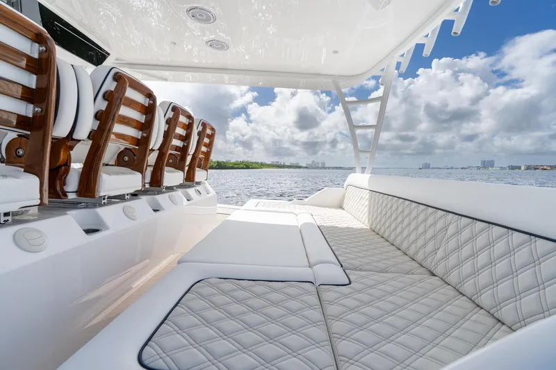Slide: The Image of 2025 Valhalla Boatworks V-55 interior with luxurious seating and ocean view. - 19