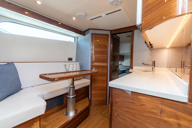 Slide: The Image of Luxurious interior of 2025 Valhalla Boatworks V-55 with modern seating and sleek wood finishes. - 30
