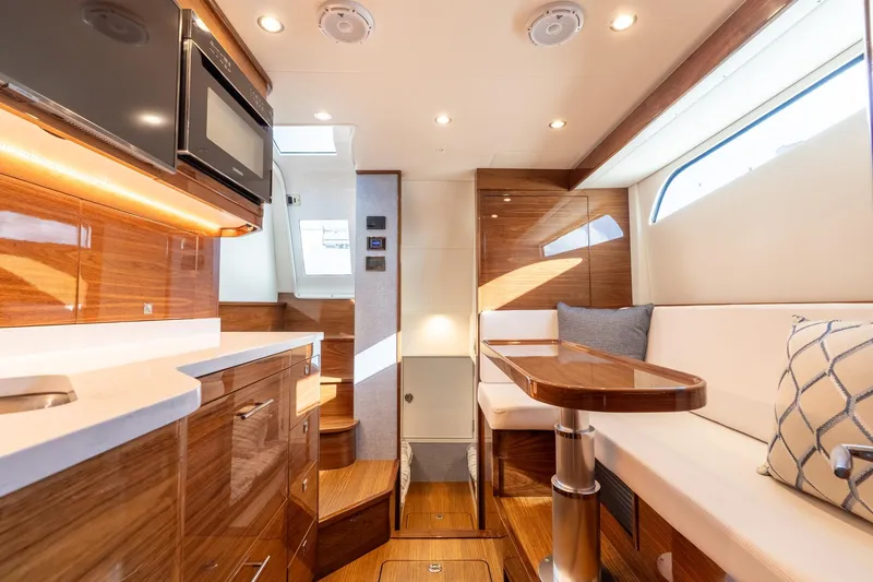 Slide: The Image of Luxurious interior of 2025 Valhalla Boatworks V-55 with modern wood finishes and seating. - 31