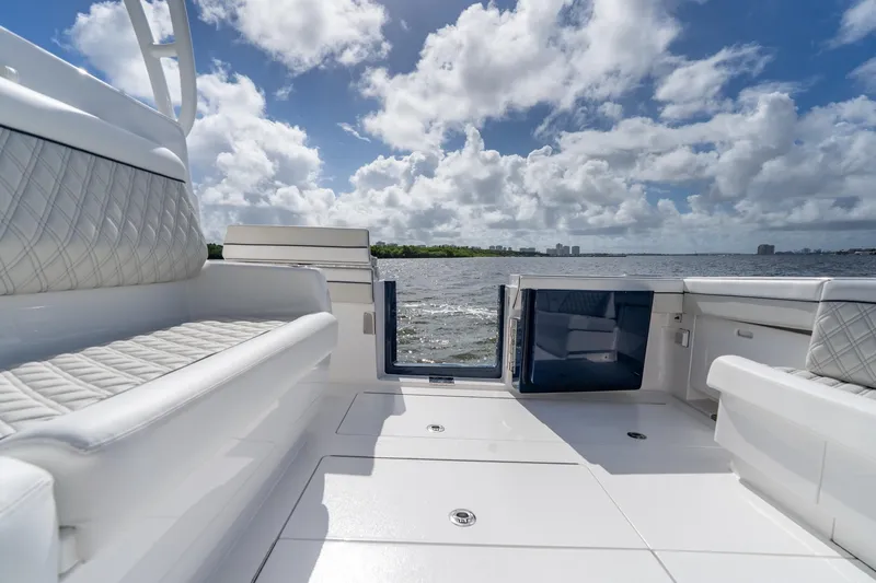 Slide: The Image of Luxurious 2025 Valhalla Boatworks V-55 interior with plush seating and ocean view. - 33
