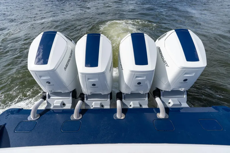 Slide: The Image of 2025 Valhalla Boatworks V-55 with four powerful Mercury outboard engines on water. - 40