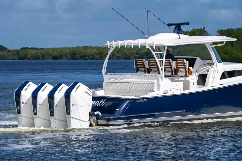 Slide: The Image of 2025 Valhalla Boatworks V-55 cruising on water with four powerful outboard engines. - 7