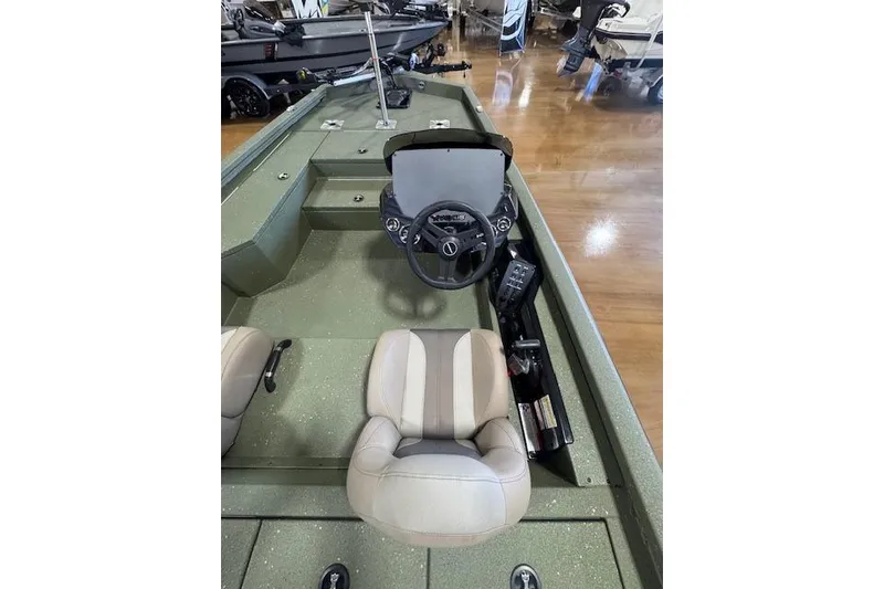 Slide: The Image of 2026 Vexus AVX181 DEFENDER boat interior with steering wheel and seating. - 9