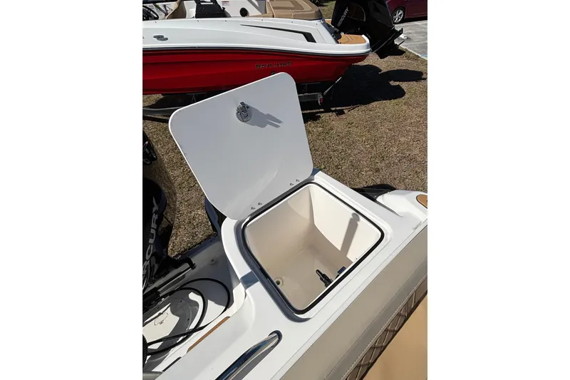 Slide: The Image of Open storage compartment on 2026 Trophy T22SC boat, showcasing interior space. - 12
