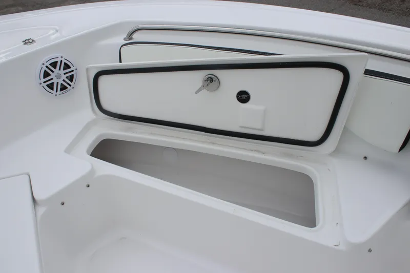 Slide: The Image of 2026 Tidewater 198 CC Adventure boat interior with white cushioned seating. - 12