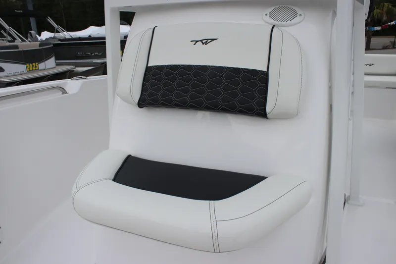 Slide: The Image of 2026 Tidewater 198 CC Adventure boat interior with white cushioned seating and speakers. - 13