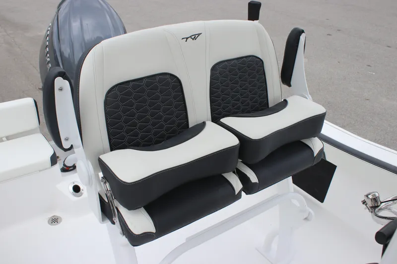 Slide: The Image of 2026 Tidewater 198 CC Adventure boat seat with black and white upholstery. - 19