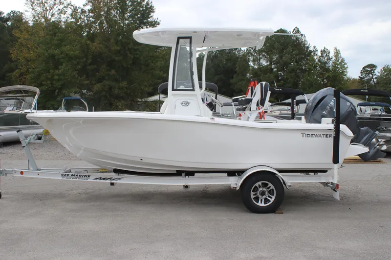 Slide: The Image of 2026 Tidewater 198 CC Adventure boat on trailer at Cove 2 Coast Marine dealership. - 2