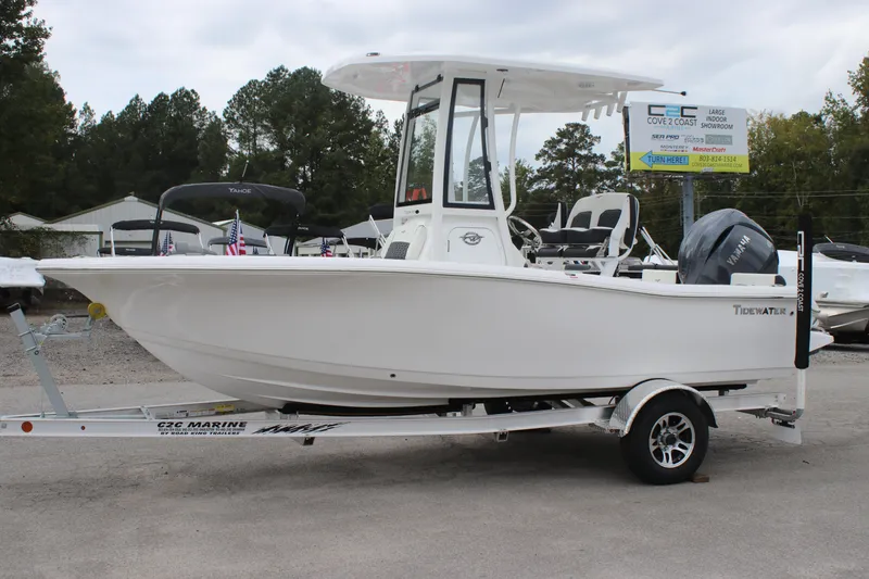 Slide: The Image of 2026 Tidewater 198 CC Adventure boat on trailer, side view, outdoors. - 3