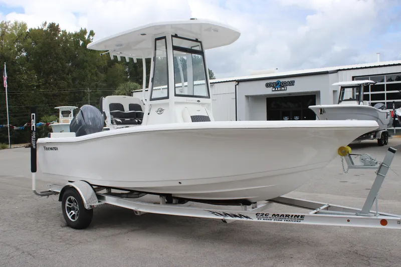 Slide: The Image of 2026 Tidewater 198 CC Adventure boat console with steering wheel and controls. - 4