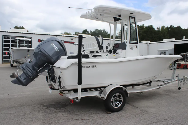 Slide: The Image of 2026 Tidewater 198 CC Adventure boat seats with black and white cushioned design. - 6