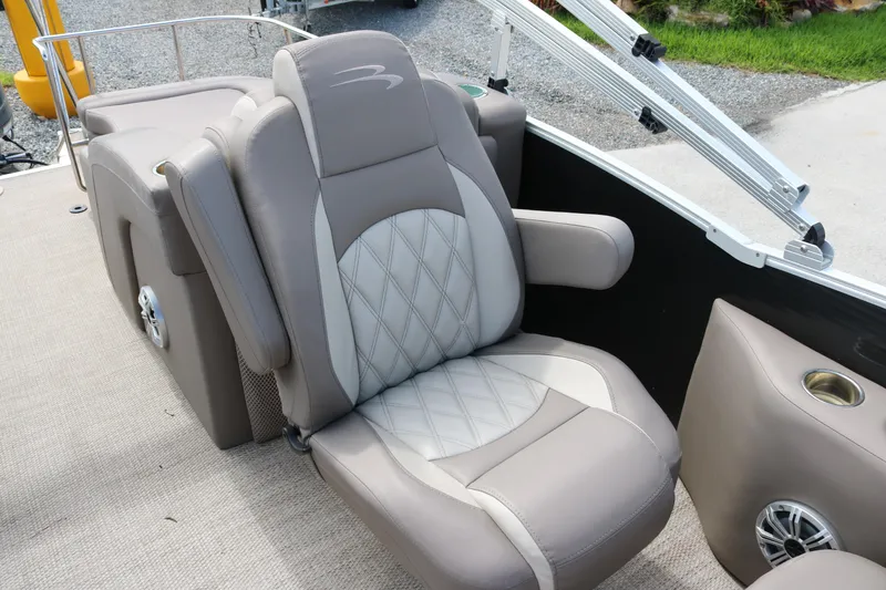 Slide: The Image of Luxurious seating on a 2018 Bennington 23 QCW pontoon boat with diamond-stitched upholstery. - 10