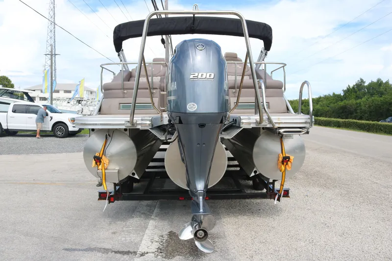 Slide: The Image of 2018 Bennington 23 QCW pontoon boat with Yamaha 200 outboard engine on trailer. - 5