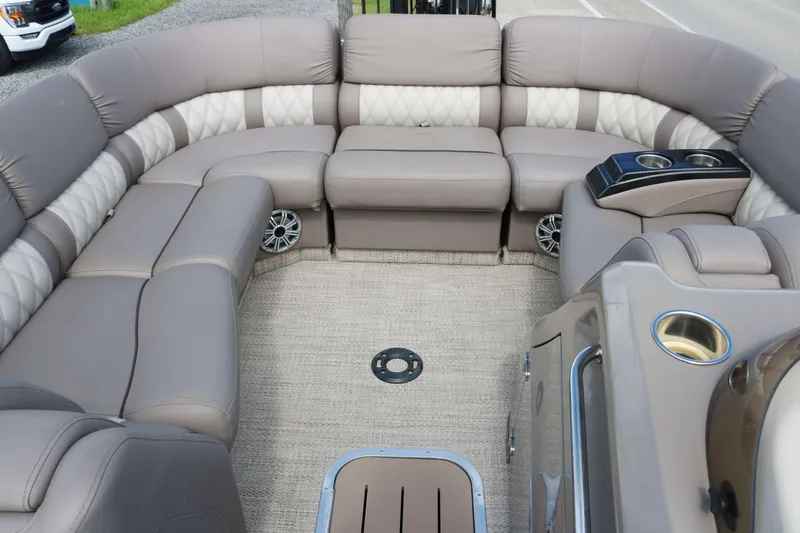 Slide: The Image of Luxurious interior of 2018 Bennington 23 QCW pontoon boat with plush seating and cup holders. - 9