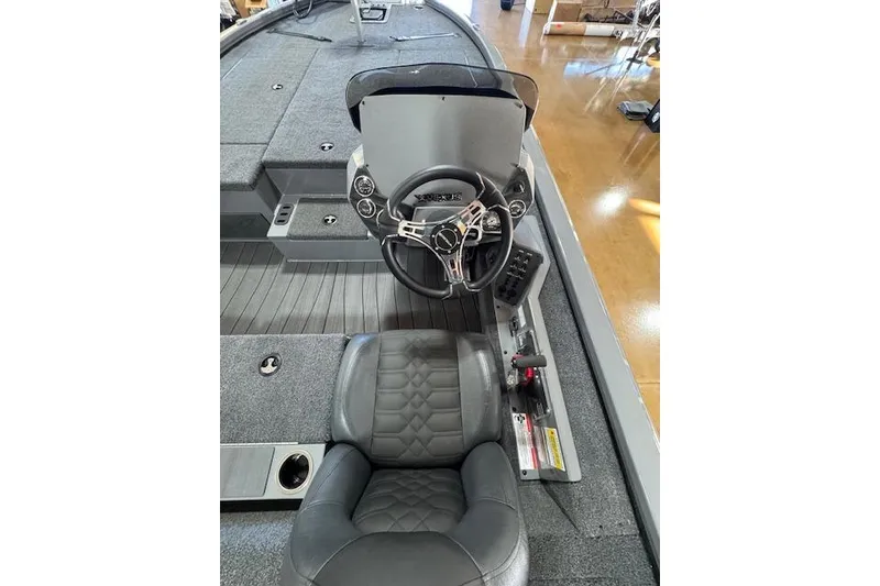 Slide: The Image of 2026 Vexus AVX 1980 boat interior with steering wheel and seating. - 11