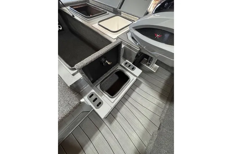 Slide: The Image of 2026 Vexus AVX 1980 boat interior with storage compartments and sleek design. - 17