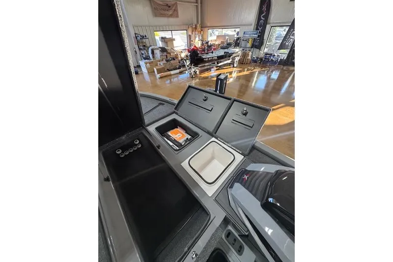 Slide: The Image of 2026 Vexus AVX 1980 boat interior with storage compartments and equipment in showroom. - 19