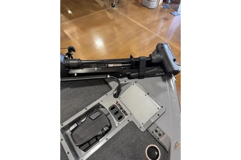 Slide: The Image of 2026 Vexus AVX 1980 boat deck with trolling motor and foot pedal controls. - 21