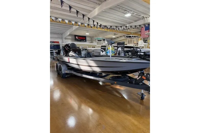 Slide: The Image of 2026 Vexus AVX 1980 boat displayed in a showroom with polished floors. - 3