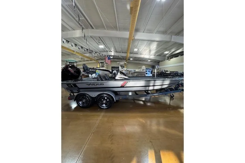 Slide: The Image of 2026 Vexus AVX 1980 boat displayed indoors, showcasing sleek design and modern features. - 4