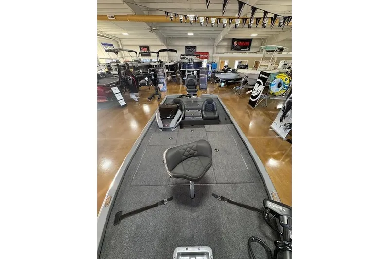 Slide: The Image of 2026 Vexus AVX 1980 boat interior in showroom, featuring seating and equipment displays. - 6