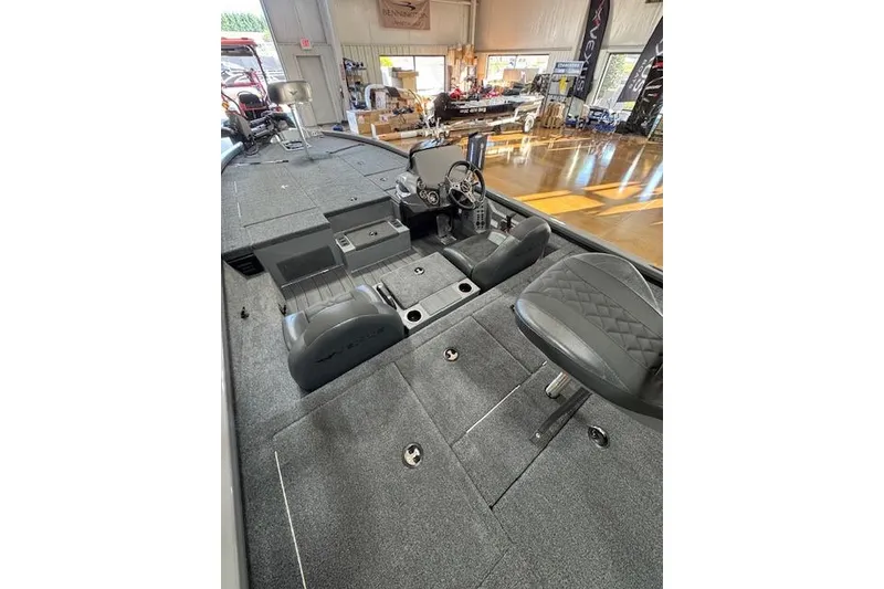 Slide: The Image of 2026 Vexus AVX 1980 boat interior with gray seating and steering console. - 9